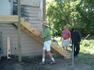 Doug and Rick building stairs with the help of Bruce.
